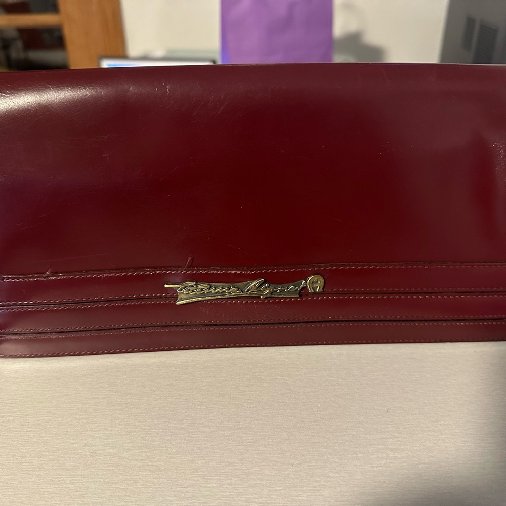 Burgundy Leather Wristlet Clutch with Gold Script Emblem